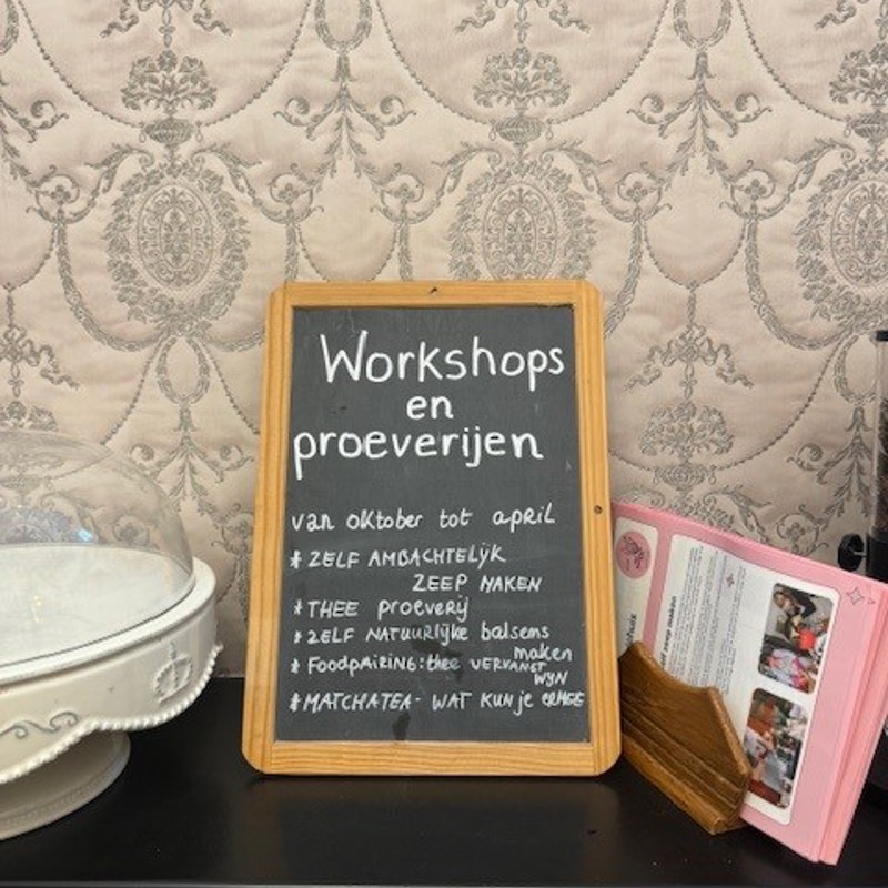 bordje over workshops in het parapluiehuis